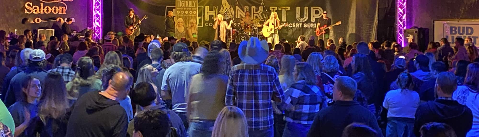 country concert with fans wearing cowboy hats Albany