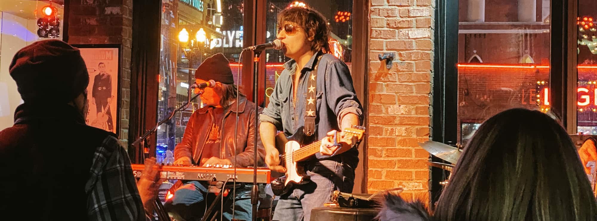 bar singer on guitar in Albany